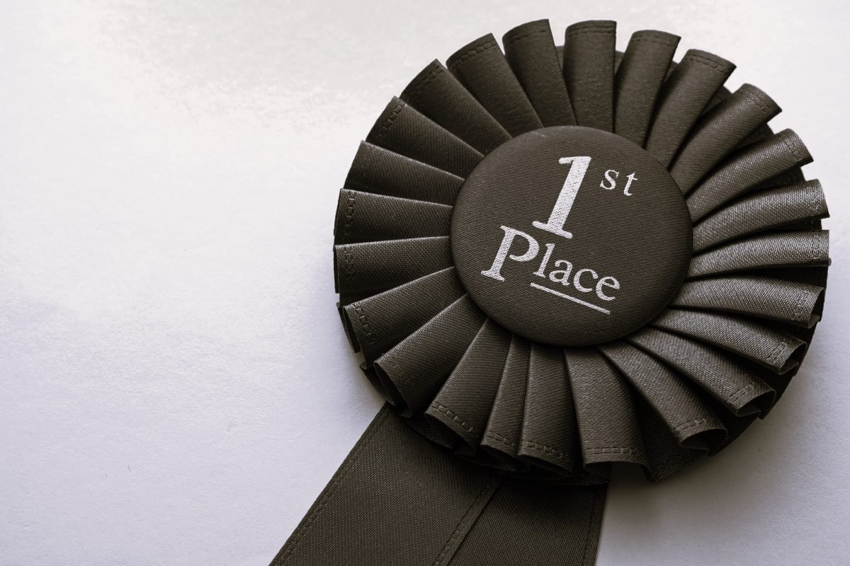 First place winners rosette with blue ribbon